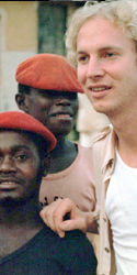Eric Madeen with two Gabonese men in red berets